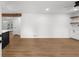 Comfortable living room with electric fireplace, built-in shelving and new hardwood floors at 1690 Eaglecreek Trl, Cumming, GA 30041