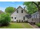 A spacious backyard including stone pavers, a picnic table, and a rear view of the house at 343 Josephine Ne St, Atlanta, GA 30307
