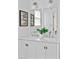 Bright bathroom with double vanity, undermount sinks, and modern lighting fixtures at 343 Josephine Ne St, Atlanta, GA 30307