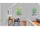 Bedroom with hardwood floors, pitched ceiling, and a wooden desk by the window at 343 Josephine Ne St, Atlanta, GA 30307
