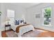 Sunlit bedroom featuring hardwood floors, large windows, and neutral color scheme at 343 Josephine Ne St, Atlanta, GA 30307