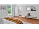 Sunlit bedroom featuring hardwood floors, large windows, and ensuite bathroom at 343 Josephine Ne St, Atlanta, GA 30307