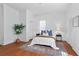 Bright bedroom featuring hardwood floors, large windows, and closet storage at 343 Josephine Ne St, Atlanta, GA 30307