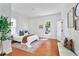 Sunlit bedroom featuring hardwood floors, large windows, and neutral color scheme at 343 Josephine Ne St, Atlanta, GA 30307