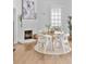 Airy dining area features a stylish brick fireplace, bright windows, and minimalist decor at 343 Josephine Ne St, Atlanta, GA 30307