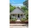 Charming home featuring a quaint front porch, beautiful landscaping, and blooming hydrangeas at 343 Josephine Ne St, Atlanta, GA 30307