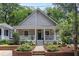 Charming single-Gathering home with a covered front porch and nicely landscaped front yard at 343 Josephine Ne St, Atlanta, GA 30307