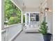 Cozy porch swing, perfect for relaxing, enhances the charm of this inviting outdoor space at 343 Josephine Ne St, Atlanta, GA 30307