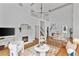 Bright living room with high ceilings, fireplace, modern lighting, and hardwood floors at 343 Josephine Ne St, Atlanta, GA 30307