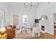 The well-lit living room features a fireplace, hardwood floors, and stylish modern decor at 343 Josephine Ne St, Atlanta, GA 30307