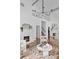 Bright living room with high ceilings, fireplace, modern lighting, and hardwood floors at 343 Josephine Ne St, Atlanta, GA 30307