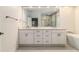 Luxurious primary bathroom with double vanity, soaking tub, and separate glass-enclosed shower at 401 Wellwood Way, Roswell, GA 30075