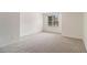 Bedroom with plush carpet and a window for natural light at 401 Wellwood Way, Roswell, GA 30075