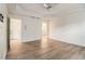 Bright bedroom featuring tray ceilings, large windows, and wood-look flooring at 401 Wellwood Way, Roswell, GA 30075