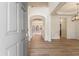 Inviting foyer with hardwood floors and an open view into the home's living spaces at 401 Wellwood Way, Roswell, GA 30075