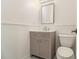 Neutral powder room with gray vanity, sink, mirror, and toilet at 401 Wellwood Way, Roswell, GA 30075