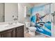Eclectic bathroom with single vanity, blue shower curtain and modern fixtures at 931 Sublime Trl, Canton, GA 30114