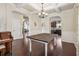 Elegant dining room with coffered ceilings, hardwood floors, and a view into the kitchen area at 931 Sublime Trl, Canton, GA 30114