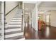 Inviting foyer with hardwood floors, staircase, and views of the living room and piano at 931 Sublime Trl, Canton, GA 30114