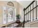 Bright entryway with large glass door, staircase, and views to the outside at 931 Sublime Trl, Canton, GA 30114