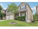 Lovely home showcasing a lush green lawn, beautiful landscaping, and a two-car garage at 931 Sublime Trl, Canton, GA 30114