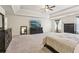 Generously sized main bedroom features tray ceilings, carpeting, dark wood furniture, and a large TV at 931 Sublime Trl, Canton, GA 30114