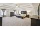Spacious main bedroom with a tray ceiling, neutral carpeting, and ample natural light from large windows at 931 Sublime Trl, Canton, GA 30114