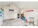 Spacious playroom area featuring carpeted floor, vaulted ceiling, and playroom decor at 931 Sublime Trl, Canton, GA 30114