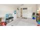 Spacious playroom area featuring carpeted floor, vaulted ceiling, and playroom decor at 931 Sublime Trl, Canton, GA 30114