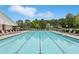 Large community pool surrounded by lounge chairs, providing a refreshing escape at 931 Sublime Trl, Canton, GA 30114