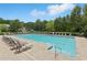 Community pool with lounge chairs, perfect for relaxing and enjoying sunny days at 931 Sublime Trl, Canton, GA 30114