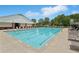 Community pool with ample seating, ideal for summer relaxation and recreation at 931 Sublime Trl, Canton, GA 30114