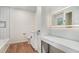 A bathroom showcasing modern lighting and fixtures and white subway tile at 1917 Connally Dr, Atlanta, GA 30344