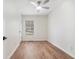 An empty bedroom with light brown, wood look flooring and a window at 1917 Connally Dr, Atlanta, GA 30344