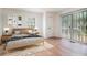 Bright bedroom with a sliding glass door and a natural wood frame bed with a patterned blanket at 1917 Connally Dr, Atlanta, GA 30344