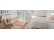 Serene bedroom featuring a soft color palette, modern furnishings, and a view of the staircase at 1917 Connally Dr, Atlanta, GA 30344