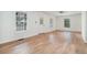 Sunlit living room featuring new flooring and multiple windows allowing natural light to flow throughout the room at 1917 Connally Dr, Atlanta, GA 30344
