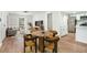 Inviting living space showcasing modern flooring, a dining area and an open flow into the kitchen at 1917 Connally Dr, Atlanta, GA 30344