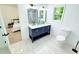Beautiful bathroom with a double vanity, framed mirrors, and a separate toilet area at 195 Burbank Nw Dr, Atlanta, GA 30314