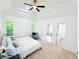 Bright main bedroom featuring a tray ceiling, neutral carpet, and ensuite bathroom and walk-in closet entrances at 195 Burbank Nw Dr, Atlanta, GA 30314