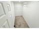 Walk-in closet with wire shelving and neutral carpet at 195 Burbank Nw Dr, Atlanta, GA 30314