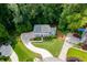 A bird's-eye view of a traditional home featuring a circular driveway and beautiful green landscaping at 2903 Brookshire Way, Duluth, GA 30096