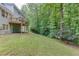 Expansive backyard offers ample space for outdoor activities and gardening at 2903 Brookshire Way, Duluth, GA 30096