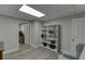 Finished basement with a bookcase, a sitting chair, and access to another room at 2903 Brookshire Way, Duluth, GA 30096