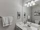 Well-lit bathroom with a large mirror, white vanity, and a convenient towel rack at 2903 Brookshire Way, Duluth, GA 30096