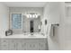 Bathroom featuring white cabinets, a bathtub with shower and toilet at 2903 Brookshire Way, Duluth, GA 30096