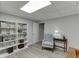 Comfortable bedroom with a light gray armchair, bookcase, and stylish decor at 2903 Brookshire Way, Duluth, GA 30096
