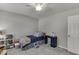 Inviting bedroom features carpet, a ceiling fan, a side table, and a bookshelf at 2903 Brookshire Way, Duluth, GA 30096