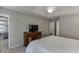 Bedroom with a TV, a tray ceiling, and a door leading to the bathroom at 2903 Brookshire Way, Duluth, GA 30096