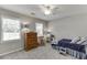 Comfortable bedroom with natural light, plush carpet, and a classic wooden dresser at 2903 Brookshire Way, Duluth, GA 30096